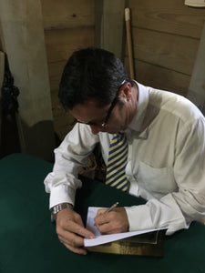Dr. Mitch Kent, author signing his book.